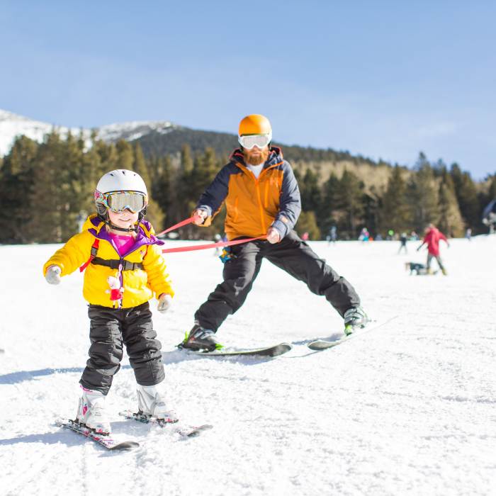 a child learns to ski at the Arizona Snowbowl