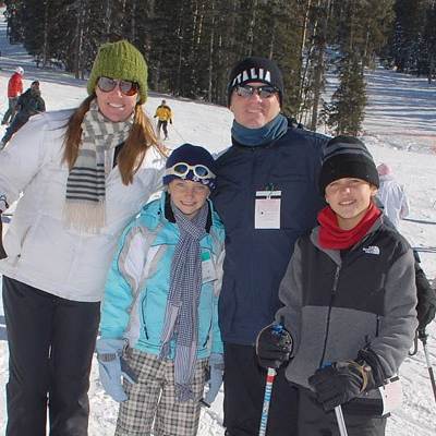family on ski slope in spring