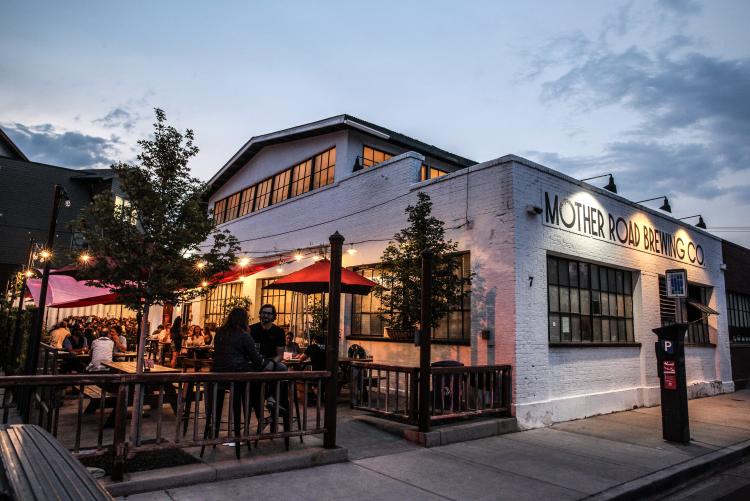 The exterior of Mother Road Brewing Company in Flagstaff, Arizona, at dusk.